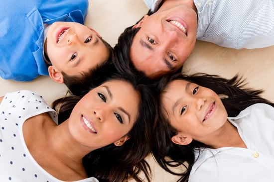 Beautiful portrait of a hispanic family with heads together
