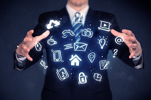 Blue multimedia icons in the hands of a businessman