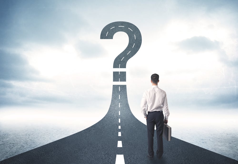 Business person looking at road with question mark sign concept-2