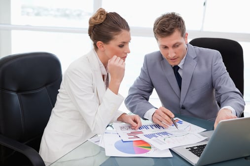 Sales team analyzing research data